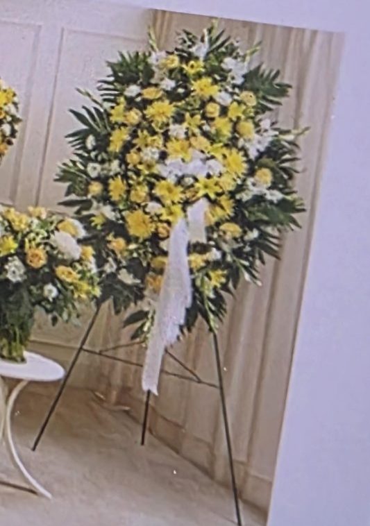 Yellow and white standing spray arrangement